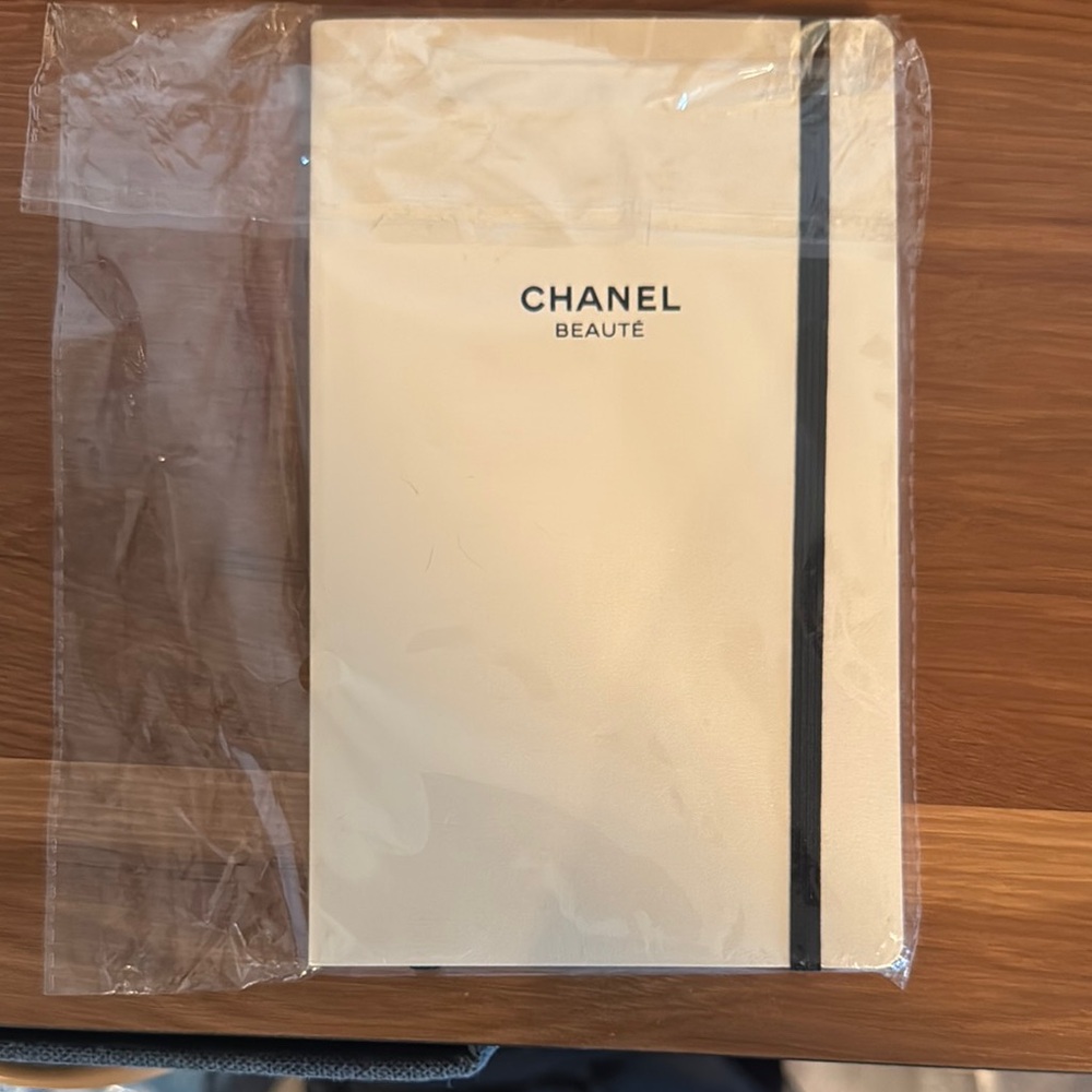 Chanel Beauté Cream and Black Notebook